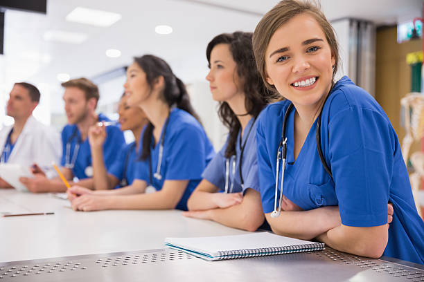 istock Medical student smiling at the camera during class 532548589