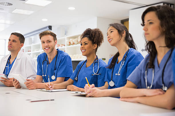 istock Medical student smiling at the camera during class 532548599
