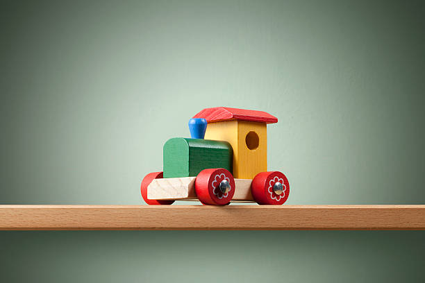 Wooden toy train on the shelf.