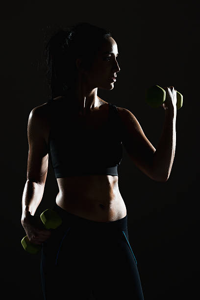 istock Sports female exercising with dumbbells 532549238