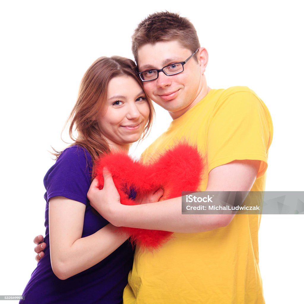 Young people in love holding heart shape toy Young people in love holding heart 2015 Stock Photo
