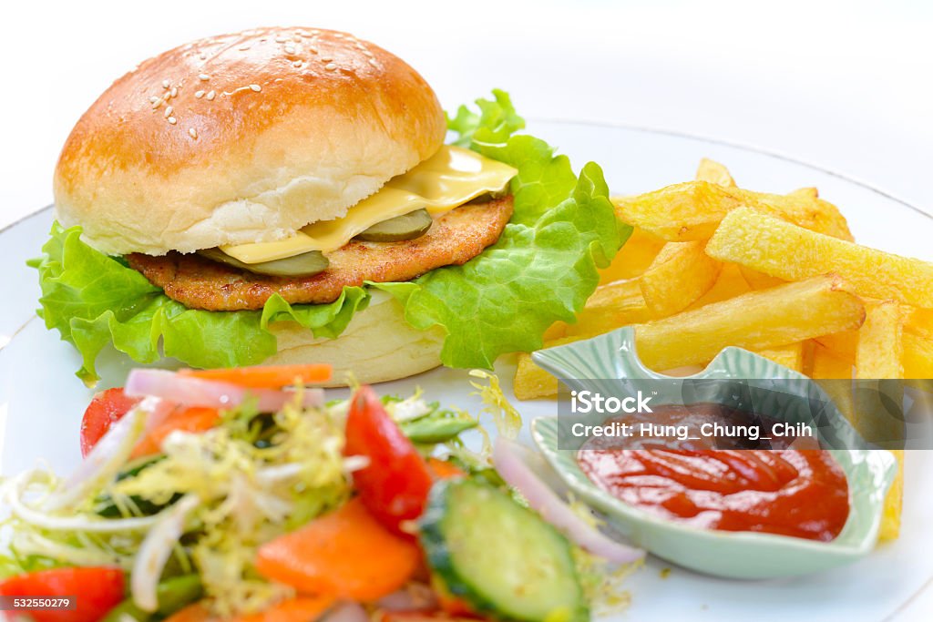 Burger with fries and salad Western high calories fast food (junk food) 2015 Stock Photo