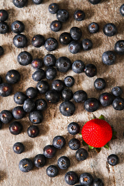 istock blueberries and strawberries on a plate stone background 532551256