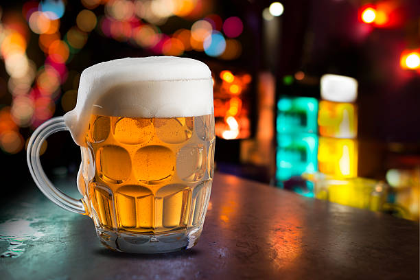 istock Glass of cold beer with bar scene 532552459