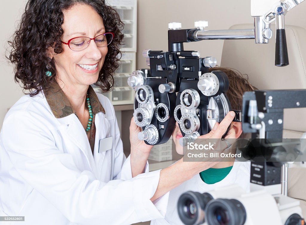 Eye Exam Young boy having eye exam in office 2015 Stock Photo