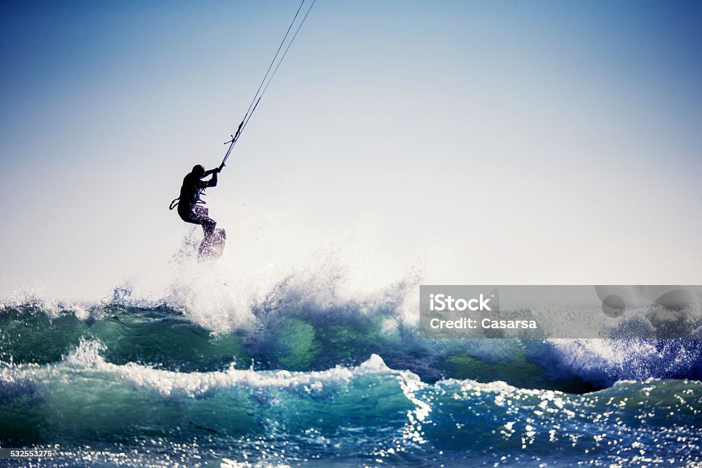 Kiteboarding Kiteboarder jumping the waves in Cape Town. Kiteboarding Stock Photo