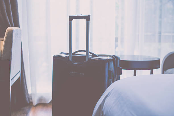 istock luggage in a hotel room 532554510
