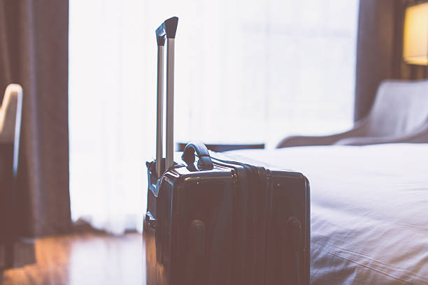 istock luggage in hotel room 532555202