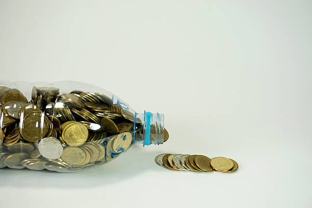 istock Saving Thai baht  coins in big recycle bottle 532557628