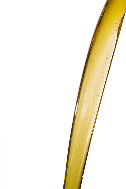 istock Pouring motor oil on white background 532557678