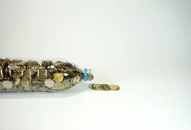 istock Thai coins in big recycle bottle 532558796