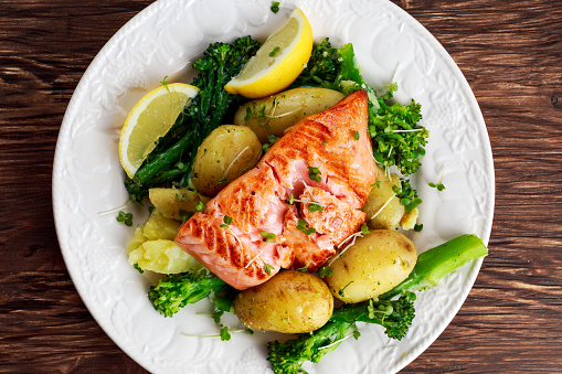 Pan fried Salmon Served with potatoes and tenderstem broccoli