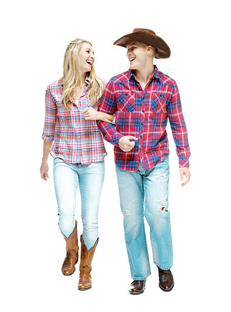istock Smiling cowboy couple walking together 532562232