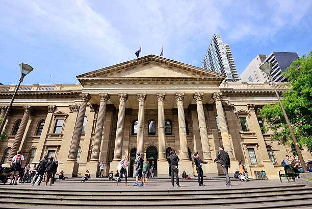 People outside State Library of Victoria in Melbourne Melbourne, Australia - October 24, 2015: People outside State Library of Victoria in Melbourne. The library is the central library of the state of Victoria and one of tourist attraction in Melbourne. university students australia stock pictures, royalty-free photos & images