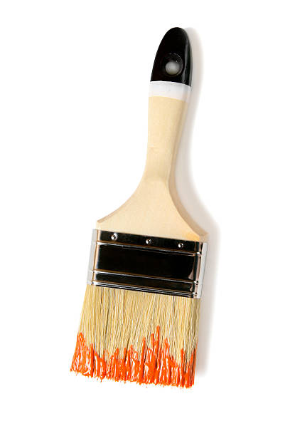 istock Paintbrush with orange paint (isolated on white) 532564944