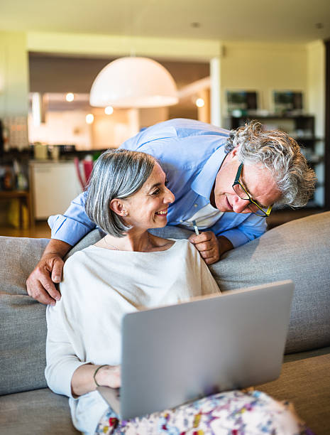 istock Relaxing mature couple doing shopping on line 532565042