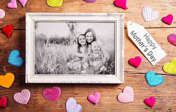 istock Mothers day composition, picture frame. Studio shot, wooden, bac 532566096
