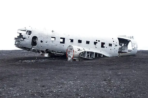 Airplane crashed in black sand beach. Navy aircraft abandoned on an beach in Iceland.