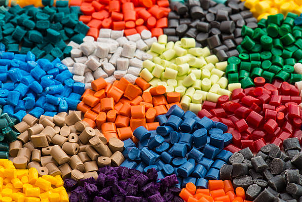 multicolrored plastic resins a variation of different dyd polymer granulates material change stock pictures, royalty-free photos & images
