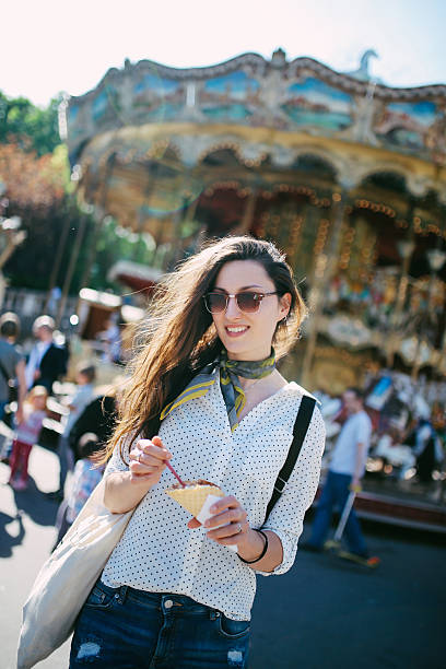 istock Young Parisian woman eating ice cream 532571058