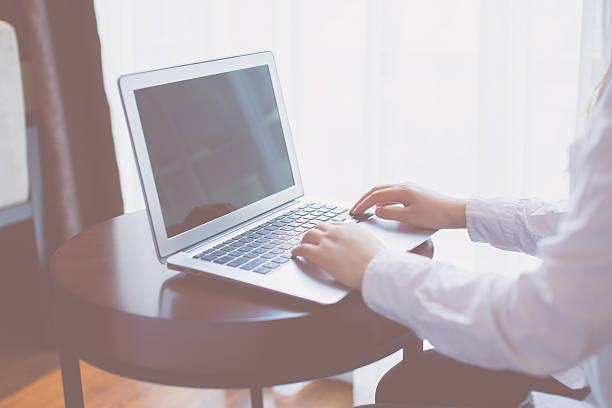 istock Close-up of woman using laptop 532571712