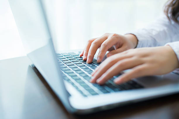 istock Close-up of hand on laptop keyboard 532572632