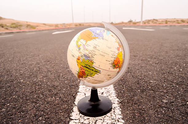 istock Globe Earth on an Asphalt Street 532574624