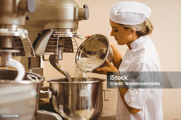 Baker Pouring Flour Into Large Mixer Stock Photo - Download Image Now - Electric Mixer, Dough, Baker - Occupation