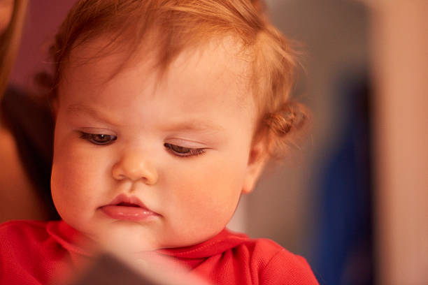 istock Toddler watching videos on digital tablet 532574952