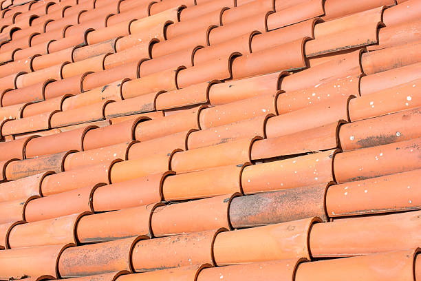 istock brown tile roof on residential building 532575008