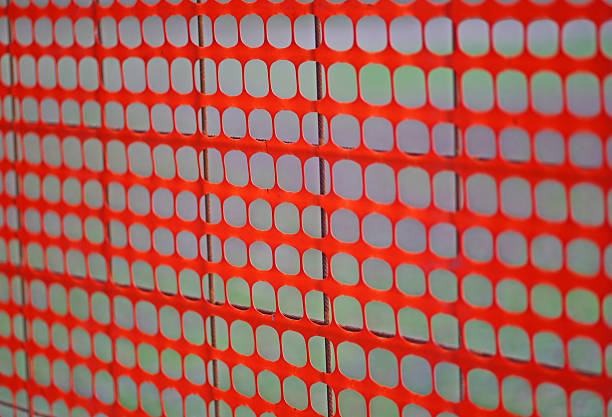 istock orange plastic mesh to delimit the roadworks 532575283