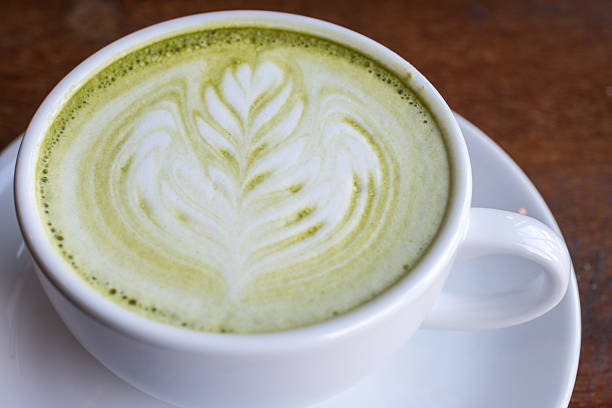 istock Hot green tea with latte milk art. 532576211