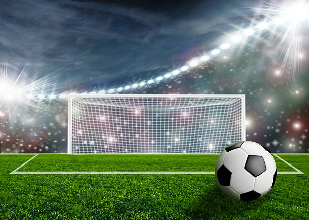 istock Soccer ball on green stadium arena 532576597