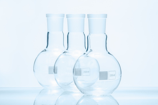 Set of three empty spherical flat bottomed temperature resistant flasks