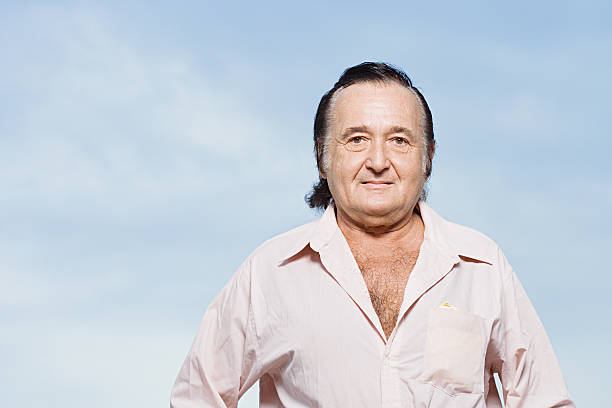 Senior man in a pink shirt