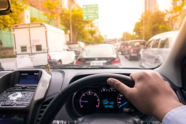 istock The Man hand driving car on the traffic jam 532577480