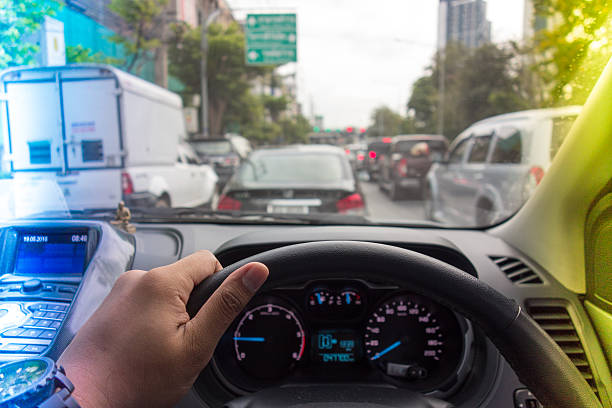 istock The Man hand driving car on the traffic jam 532577620