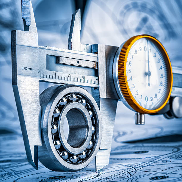 istock Ball bearings and Metal vernier caliper 532577622
