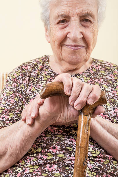 istock senior woman with cane 532578002