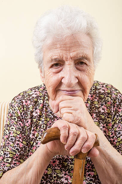 istock senior woman leaning on a cane 532578268