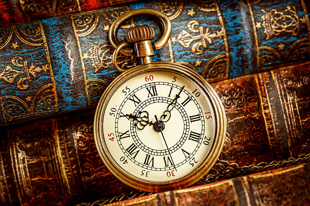 istock Old Books and Vintage pocket watch 532579226