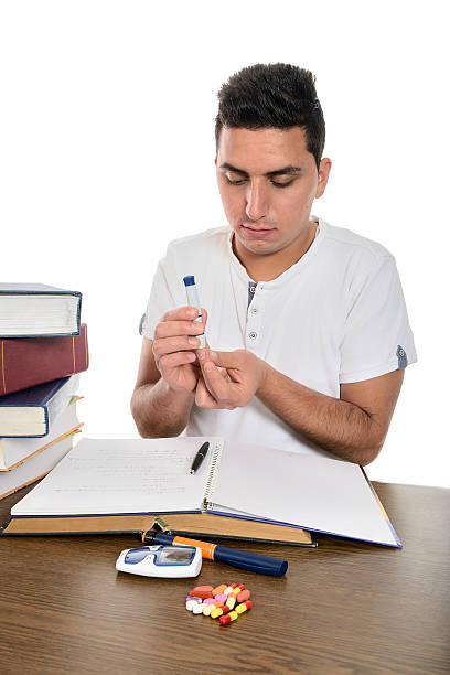 studente con diabete - blood sugar test examining instrument of measurement diabetes foto e immagini stock