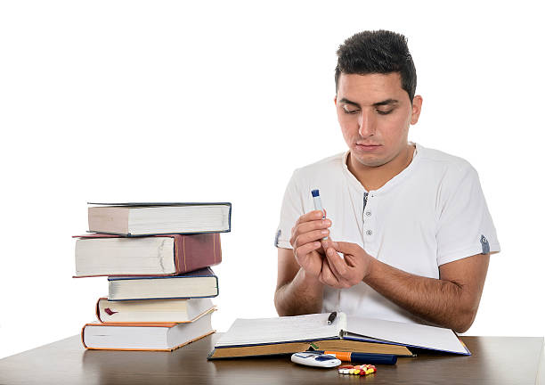 studente con diabete - blood sugar test examining instrument of measurement diabetes foto e immagini stock