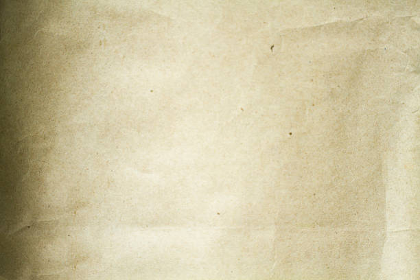 istock Crumpled paper background vignette and texture 532579868
