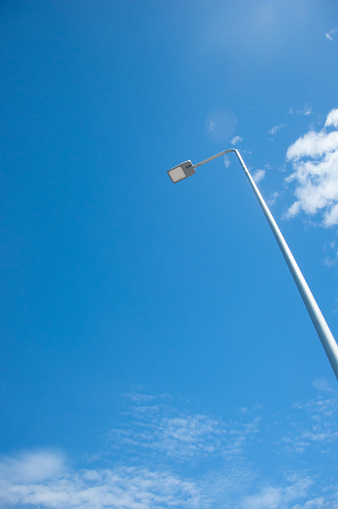 LED Street Lamps Affixed to an Iron Post Against