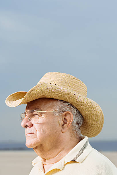 istock Man wearing a straw cowboy hat 532581309
