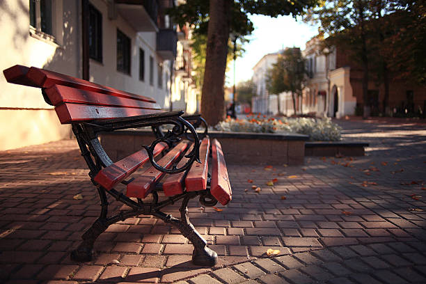 istock garden bench in autumn park landscape 532591703