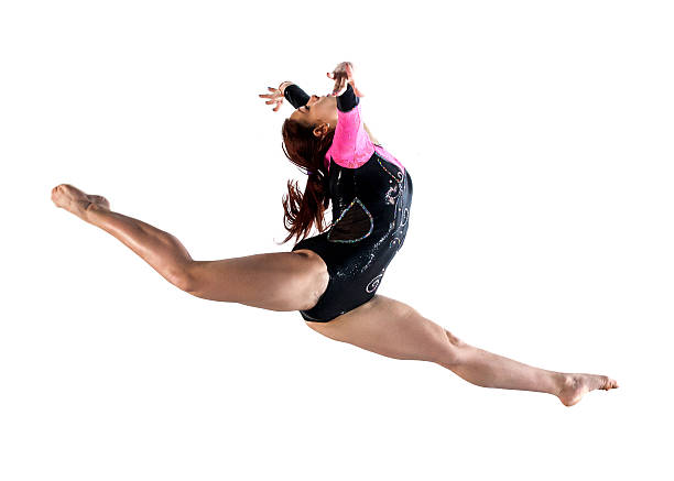 istock Young woman doing gymnastics jump 532591895