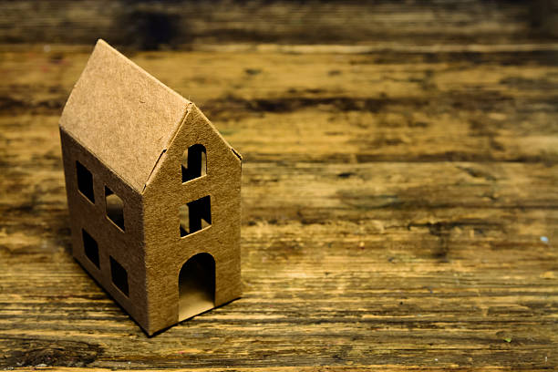 istock Recycle paper house on wooden table 532594855