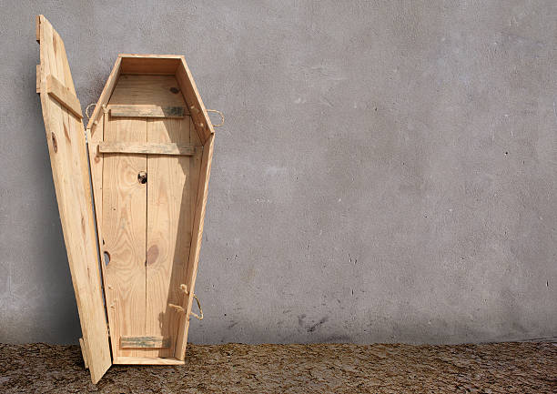 Outdoor,simple coffin of the grey walls. The illustration on the theme of death and people. coffin photos stock pictures, royalty-free photos & images